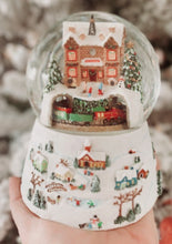 Load image into Gallery viewer, North Pole Station Glitter Dome with rotating train Wind up &quot; Deck the Halls &quot; Dimensions: 5.75&quot;H 4.5&quot;W 4.5&quot;L
